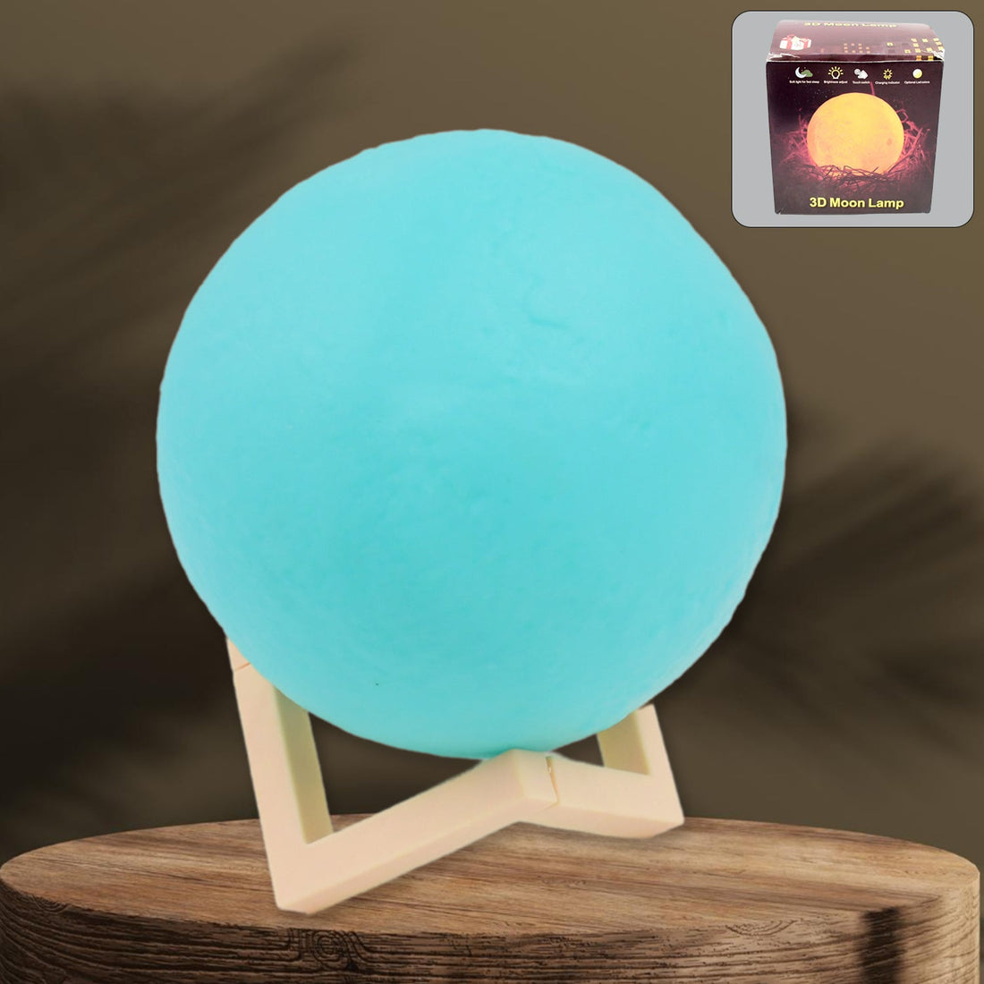 A serene blue Moon Night Lamp illuminating a dark room, creating a calming ambiance.